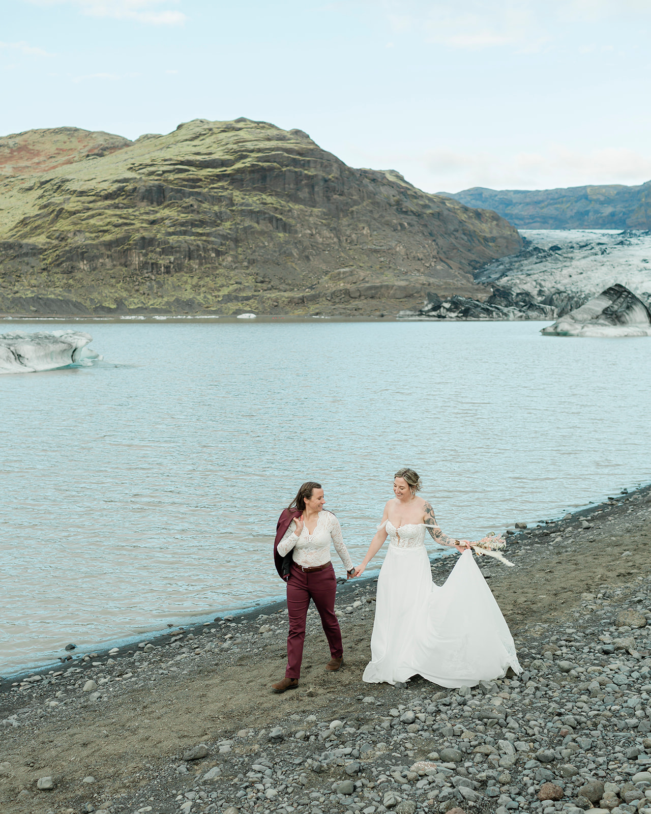 Planning a South Iceland elopement? See Kendra and Val's unforgettable wedding featuring waterfalls, a glacier, and the stunning landscapes around Vík