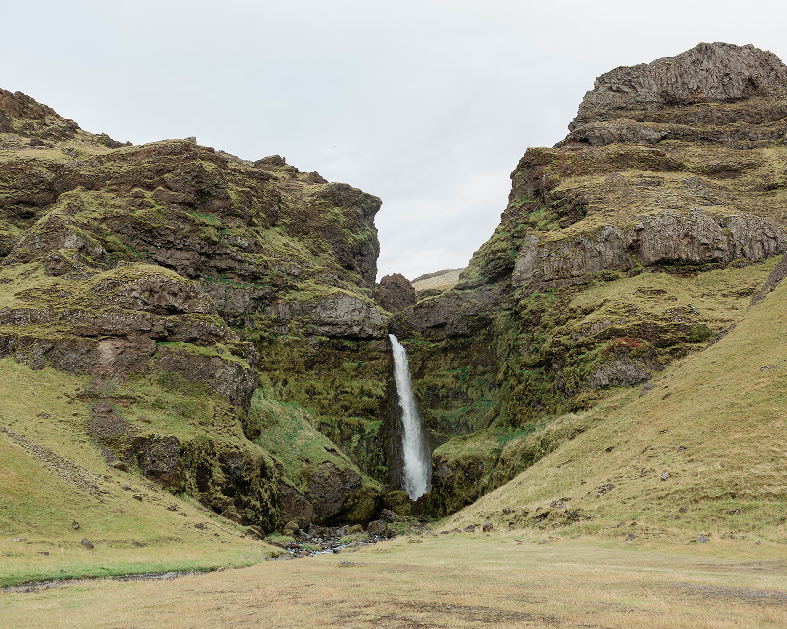 Planning a South Iceland elopement? See Kendra and Val's unforgettable wedding featuring waterfalls, a glacier, and the stunning landscapes around Vík