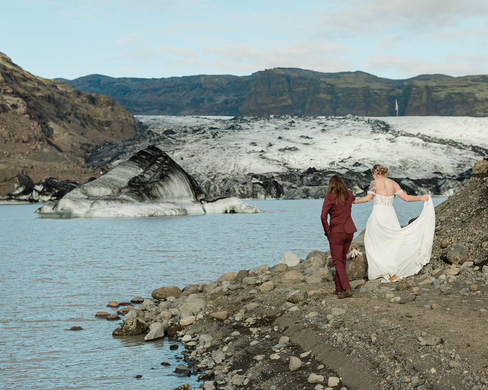 Planning a South Iceland elopement? See Kendra and Val's unforgettable wedding featuring waterfalls, a glacier, and the stunning landscapes around Vík