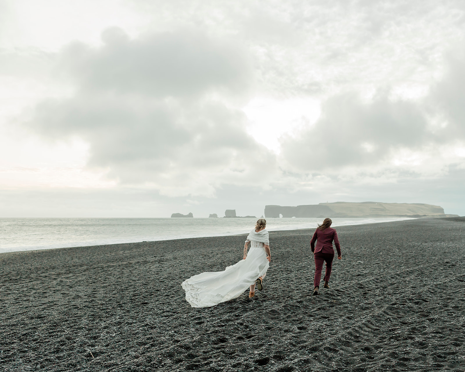 Planning a South Iceland elopement? See Kendra and Val's unforgettable wedding featuring waterfalls, a glacier, and the stunning landscapes around Vík