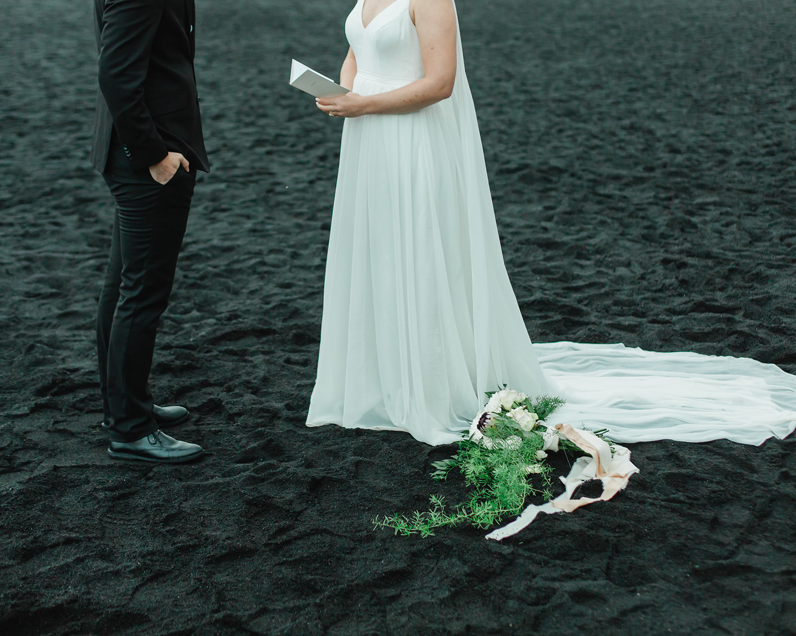 See Michael & Nicole's Iceland beach elopement on Iceland's South Coast, with waterfalls, black sand beaches, and planning inspiration.