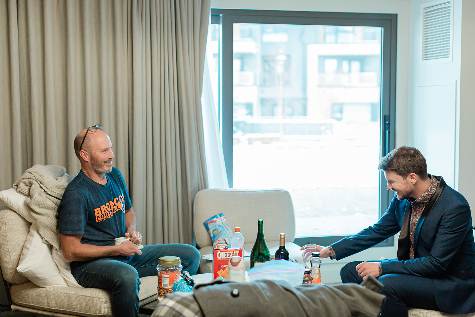 Bronson getting ready with family before his Banff winter elopement in Banff National Park.