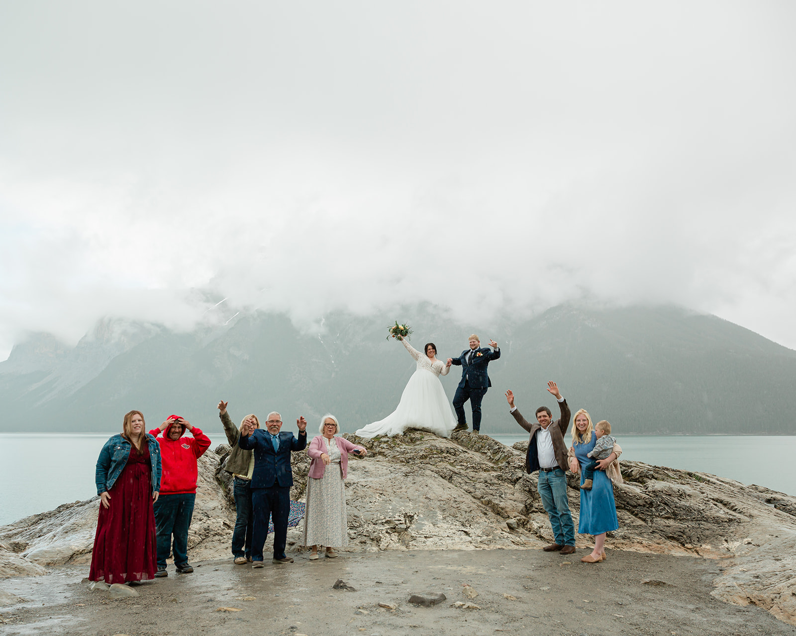 See Rachel and Russell’s Lake Minnewanka elopement, from an intimate Banff ceremony and rainbow to Two Jack Lake, dancing, and star photos.