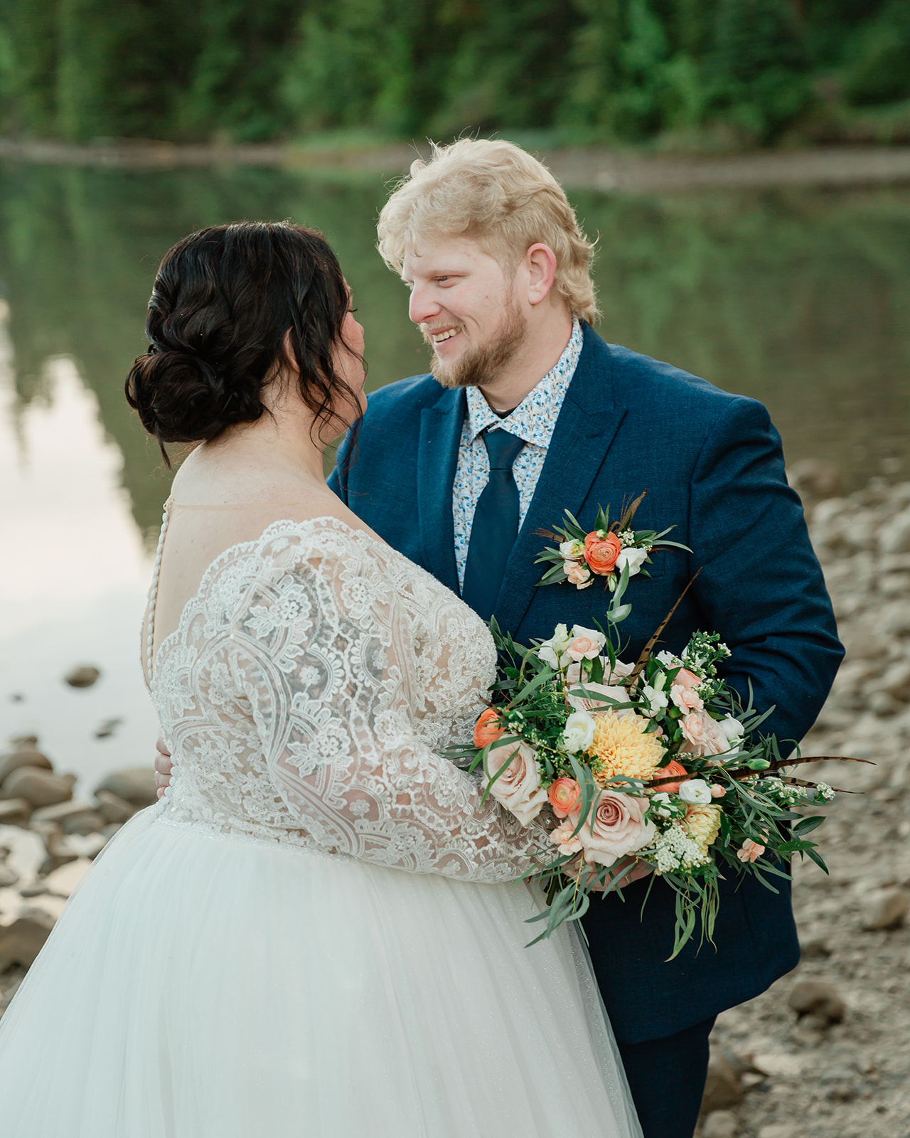 See Rachel and Russell’s Lake Minnewanka elopement, from an intimate Banff ceremony and rainbow to Two Jack Lake, dancing, and star photos.